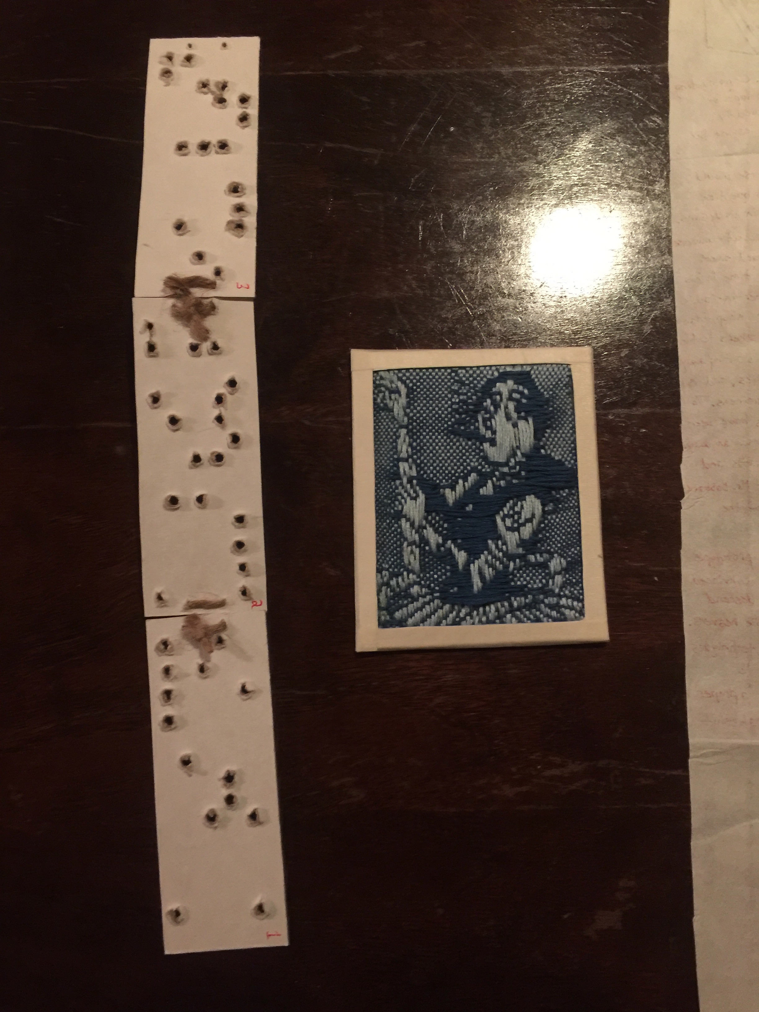 A loom punchcard and woven Ada Lovelace